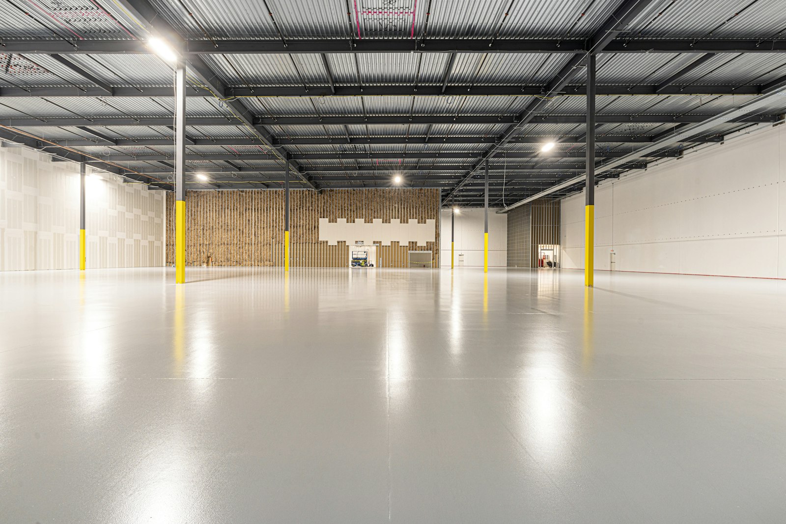A wide, empty warehouse